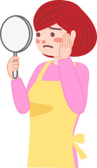 鏡を手に持って顔を見ている主婦