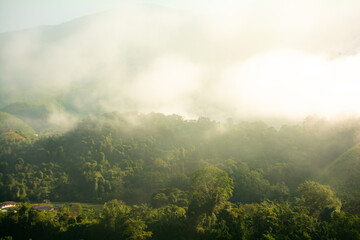 Beautiful mountains under mist in the morning,fog and cloud tropical landscape Welcoming travelers.