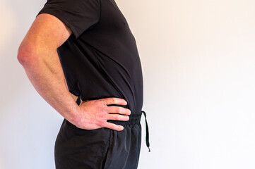 Common body posture defect. Lordosis curvature of the spine. Man with lordosis.