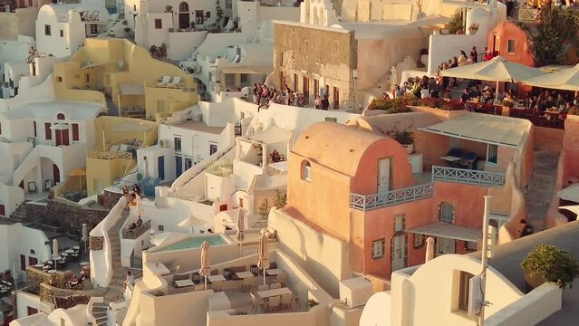 Santorini, Greece - 25 May, 2020: Large crowd of people waiting for the sunset at the city of Oia, Santorini, Greece