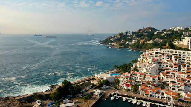 Manzanillo, Mexico - 11.21.2022 Aerial view of Peninsula de Santiago in city Manzanillo, Mexico. Beautiful bitch and luxury hotels and boat and yacht berth