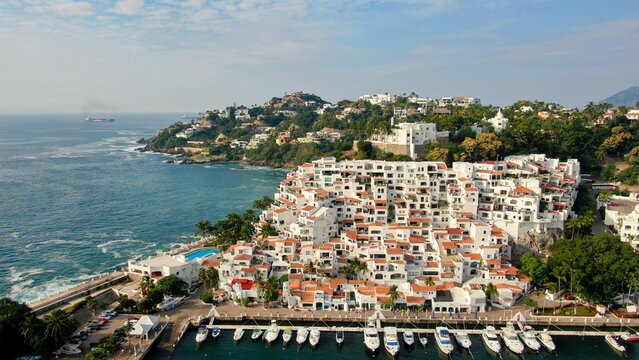 Manzanillo, Mexico - 11.21.2022 Aerial view of Peninsula de Santiago in city Manzanillo, Mexico. Beautiful bitch and luxury hotels and boat and yacht berth