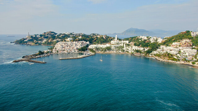 Aerial view of Peninsula de Santiago in city Manzanillo, Mexico. Beautiful bitch, luxury hotels and yachting bay.