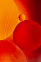 oil drops on the water surface, vertical