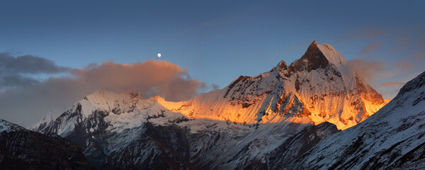 Snow capped Mt. Machapuchare at sunset, view from Annapurna base camp.