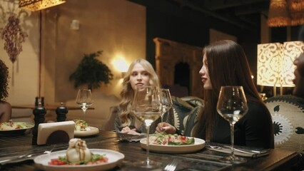 hen party in luxury restaurant in weekend, beautiful multi ethnic women talking and gossiping