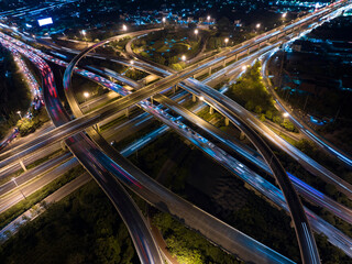 Fototapeta na wymiar Traffic transportation above circle road of Drone aerial view fly , high angle. Public transport or commuter city life concept of economic and energy