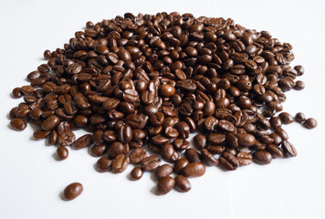 Heaps of dark roast coffee beans