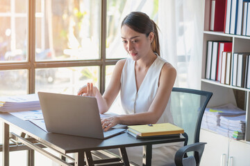Fototapeta premium Marketing, Finance, Accounting, Planning, Team female accountant using laptop calculator and documents, charts, graphs in the analysis of the company is profit.