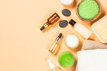 Spa and wellness products at trendy beige background. Flat lay image with copy space.