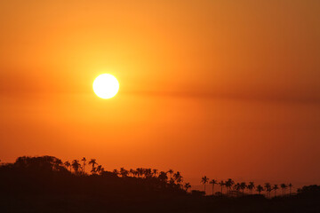 The setting sun ignites the sky into a myriad of beautiful colours at sunset.