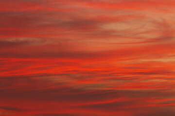 The setting sun ignites the sky into a myriad of beautiful colours at sunset.
