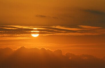 The setting sun ignites the sky into a myriad of beautiful colours at sunset.
