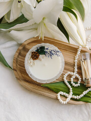 Soy candle with dried flowers. Scented candle for home. Candle in glass candle holder. Natural