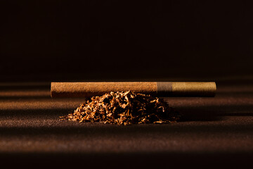 Cigarette. Cigarette and tobacco leaves close-up. Selective focus. Bad habits