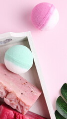 Bath bombs and soap in bathroom, wellness treatment