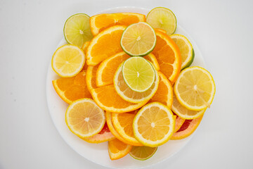 bowl of healthy fresh fruit salad on a white background. Top view with copy space. Lying flat
