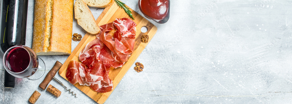 Wall mural traditional spanish ham with ciabatta and red wine.