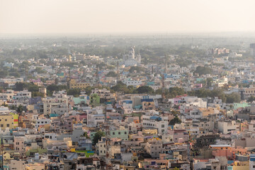 Obraz premium An aerial cityscape of low rise buildings in the town of Trichy in Tamil Nadu, India.