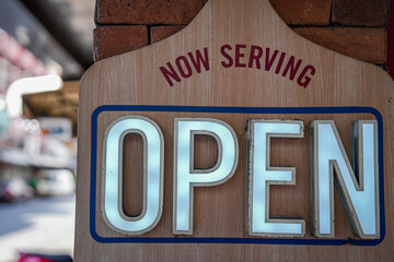 pizza shop is open vintage sign, now serving light sign.