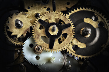 Gears of a vintage clock mechanism close-up