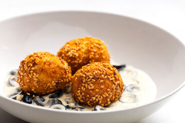chickpeas balls with creamy black olives sauce