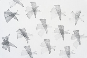 background with ink-stamp pattern (overlapping triangle or wedge shapes)