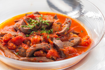 still life of kidney stew with tomatoes