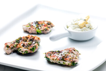 grilled poultry meat with herbs served with blue cheese dip