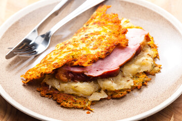 potato cakes with smoked meat and sour cabbage