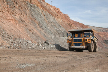 Large dump truck for removal of rock mass from the quarry for open-pit mining of minerals. Initial...