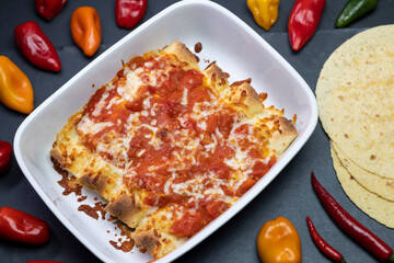 burritos baked with tomato sauce and cheddar cheese
