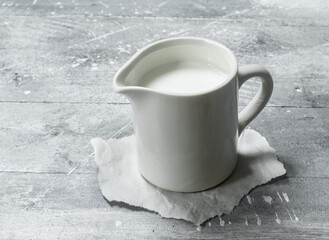 Milk in a cup on paper.