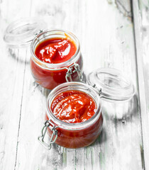 Tomato sauce in glass bowls.