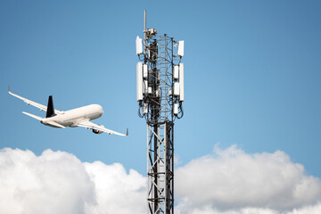 Mobile phone cell tower with 5G on the C Band frequencies with aircraft taking off. Airlines worried about interference with plane altimeter. removed logos