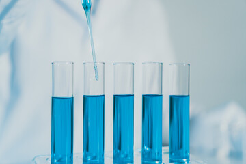 Scientist experimental in laboratory with test tube and beaker for medical research