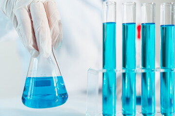 Scientist experimental in laboratory with test tube and beaker for medical research