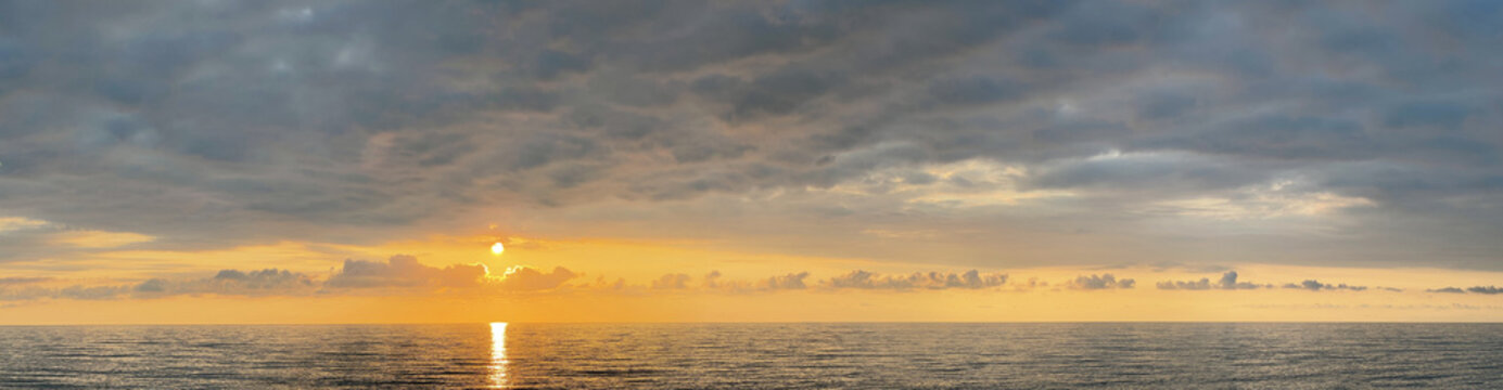 Beautiful seascape panorama. Sea, sky, sun and cloud environment. Atmosphere cloudscape