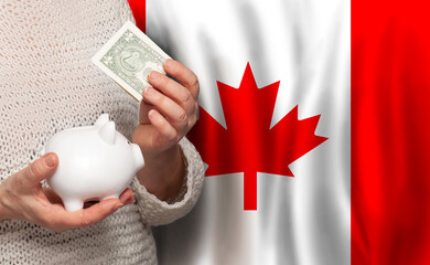 Canadian woman with money bank on the background of Canada flag. Dotations, pension fund, poverty, wealth, retirement concept - obrazy, fototapety, plakaty