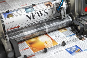 Newspaper or hournal with news printing on a printing machine in a typography.