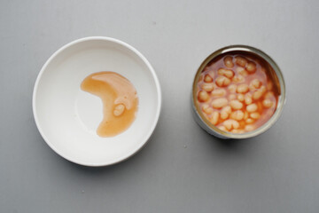 preserved canned tomato beans on table 