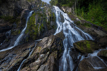 Picturesque waterfall cascade on granite rocks in dense tropical forest, Namuang 2, Samui, Thailand