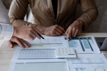 Atmosphere of a startup company meeting, business people are meeting together to summarize and plan investment finances, they are the founders of the company. Business administration concept.