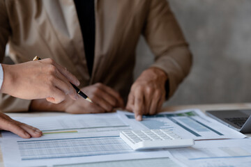 Atmosphere of a startup company meeting, business people are meeting together to summarize and plan investment finances, they are the founders of the company. Business administration concept.