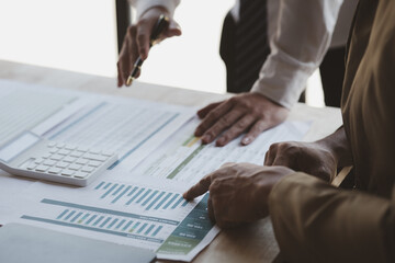 Atmosphere of a startup company meeting, business people are meeting together to summarize and plan investment finances, they are the founders of the company. Business administration concept.