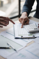 Atmosphere of a startup company meeting, business people are meeting together to summarize and plan investment finances, they are the founders of the company. Business administration concept.