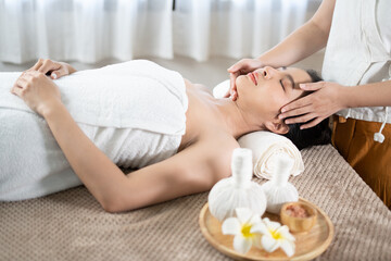 Fototapeta na wymiar Young Asian beauty woman enjoying massage and spa.