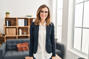 Young woman working at consultation office with a happy and cool smile on face. lucky person.