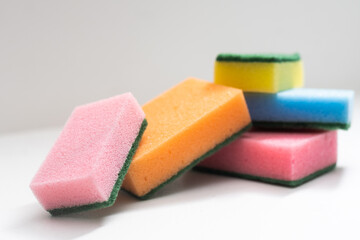 Kitchen dishcloth, cleanup concept, housework. Colorful kitchen sponges for cleaning close-up, housekeeping.