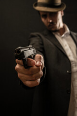 old school gangster with gun in hand